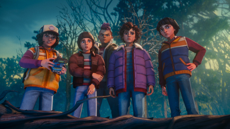 Braxton Quinney as Dustin, Benjamin Plessala as Will, Brooklyn Davey Norstedt as Eleven, and Luca Diaz as Mike standing in a wintry forest in Stranger Things: Tales From '85