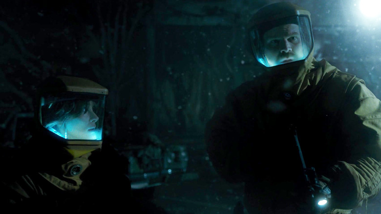 Hopper and Joyce traversing the Upside Down in Stranger Things