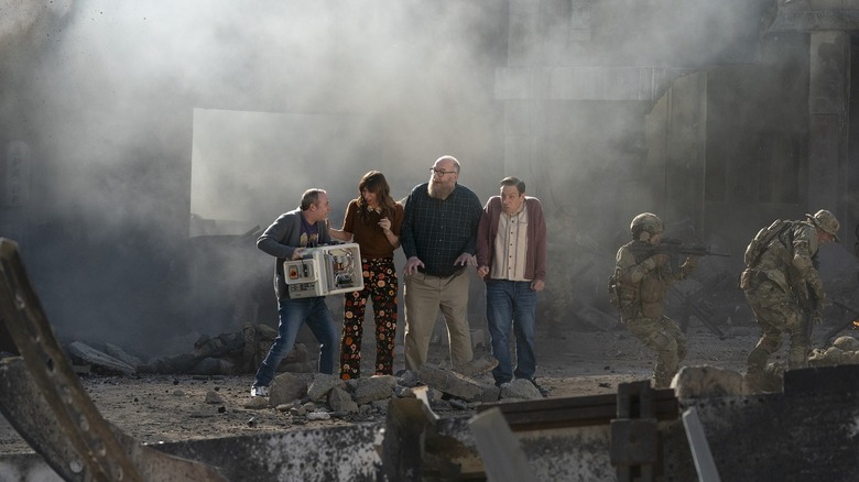 Stuart holding an air condiitoner next to Denise, Bert, and Barry on Stuart Fails to Save the Universe