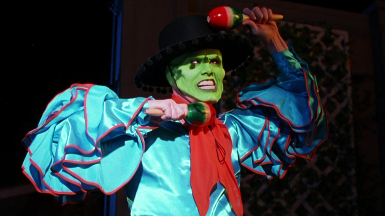 Jim Carrey's Stanley Ipkiss/Mask holds up maracas as he dances in The Mask