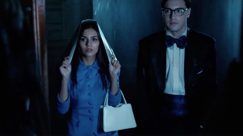 Janet and Brad walking through the rain