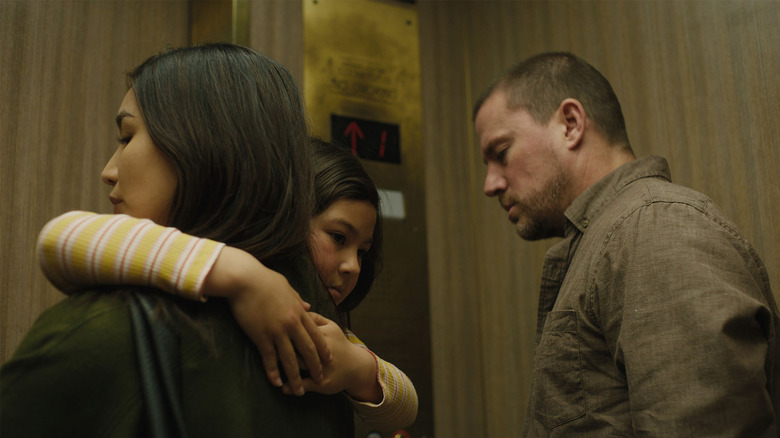 Gemma Chan and Channing Tatum in an elevator with Mason Reeves in Josephine