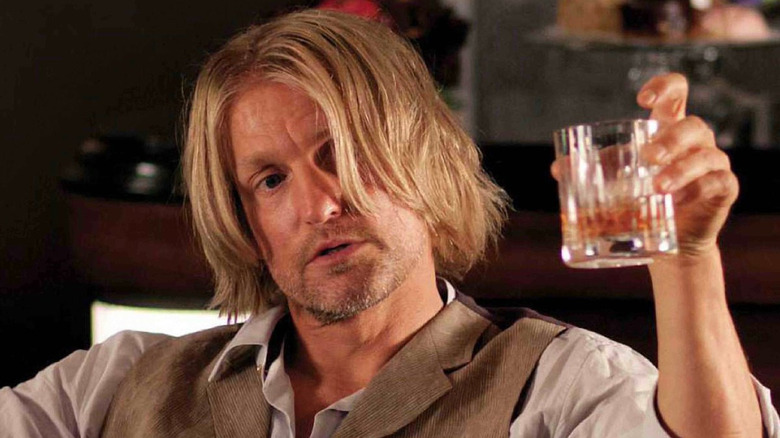Haymitch raising a glass in The Hunger Games
