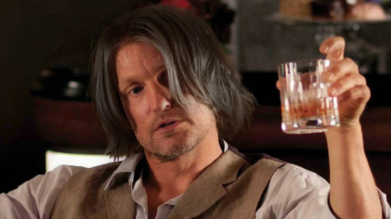 Haymitch raising a glass in The Hunger Games