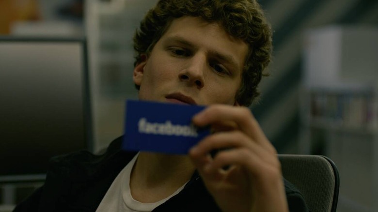 Zuckerberg looks at Facebook card
