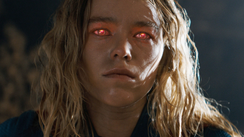 Milly Alcock as Supergirl with her red glowing eyes in Supergirl (2026)