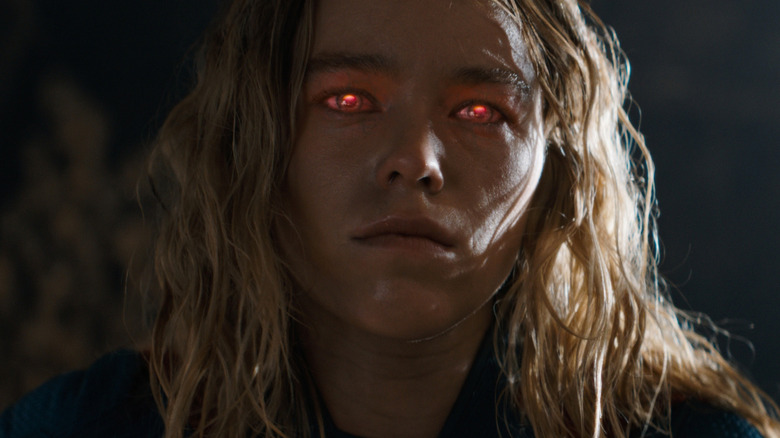 Milly Alcock as Supergirl with her red glowing eyes in Supergirl (2026)