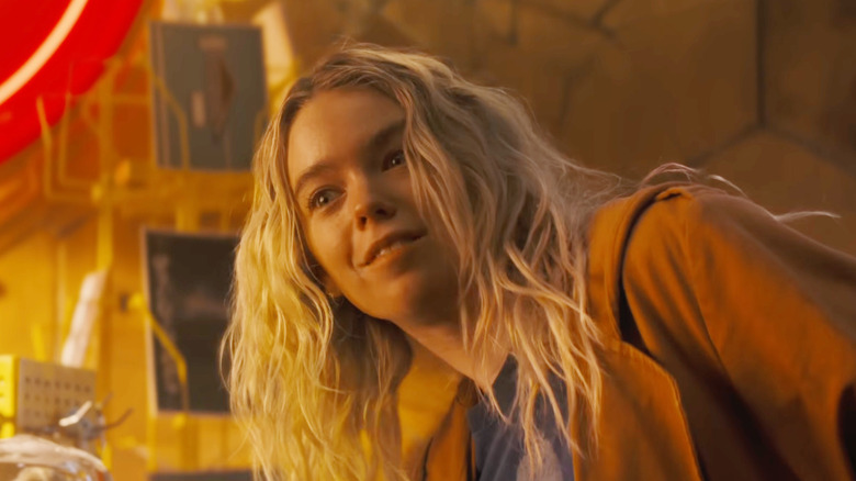 Milly Alcock as Supergirl cocking her head while grinning in Supergirl (2026)
