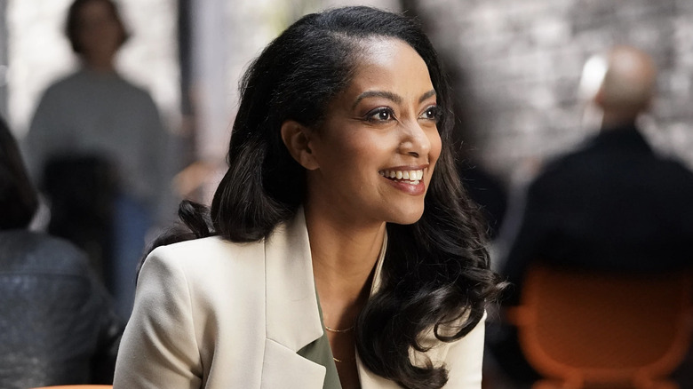 Azie Tesfai at a restaurant table in A Million Little Things