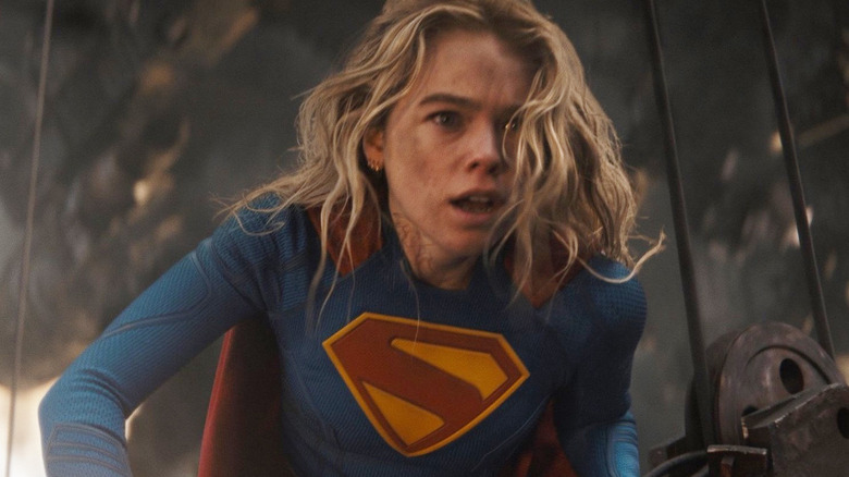 Milly Alcock as Supergirl leaning over the side of the ship with a look of panic on her face in Supergirl (2026)
