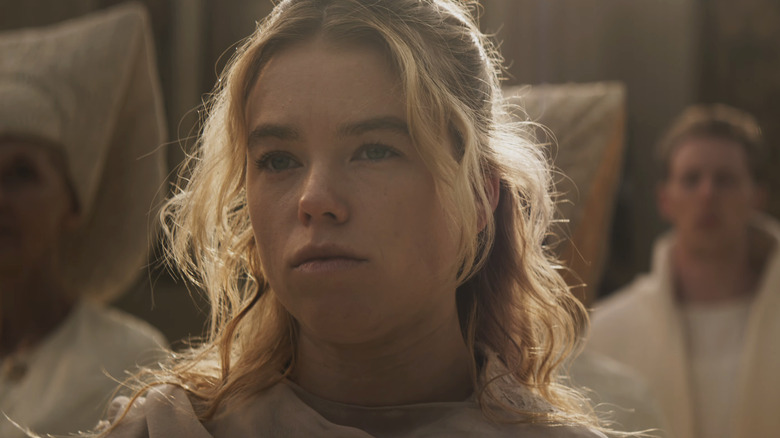 Milly Alcock as Kara wearing white robes on Krypton in Supergirl (2026)