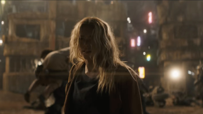 Kara engages in battle in the ruined streets of Evely town square