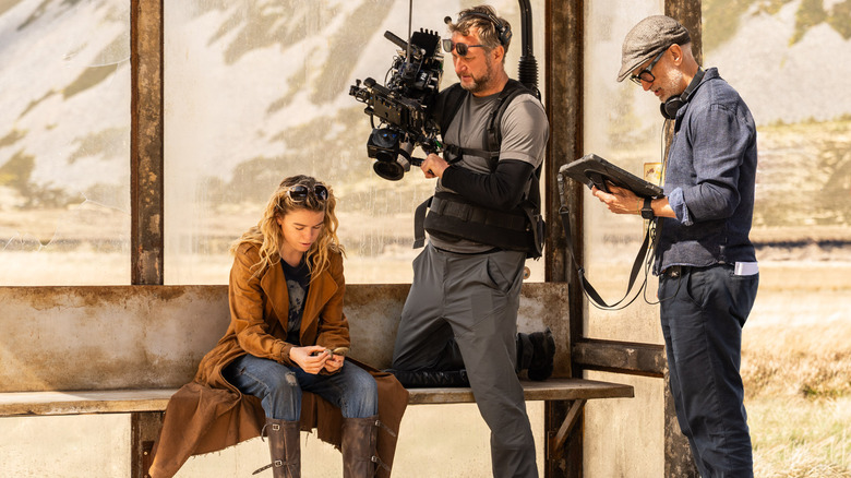 Craig Gillespie directs Mily Alcock on the set of Supergirl