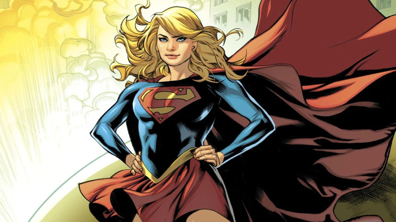 Supergirl stands with her hands on her hips