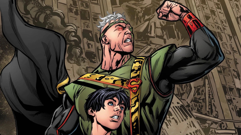 Jor-El with Jon Kent in front of a destroyed building