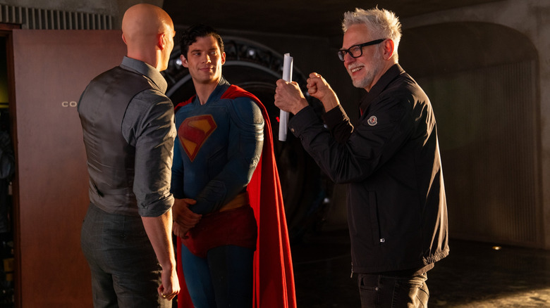 Director James Gunn standing next to Nicholas Hoult as Lex Luthor and David Corenswet as Superman on the set of Superman