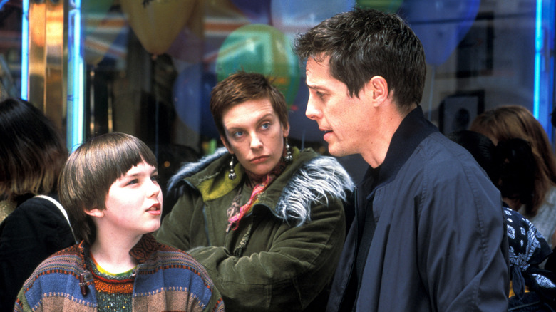 Nicholas Hoult with Toni Colette and Hugh Grant in About a Boy
