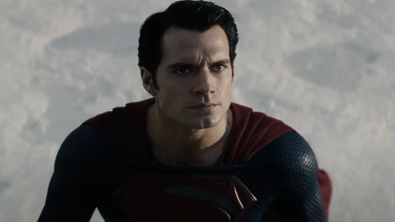 Henry Cavill's Superman looks up as he stands in snow in Man of Steel