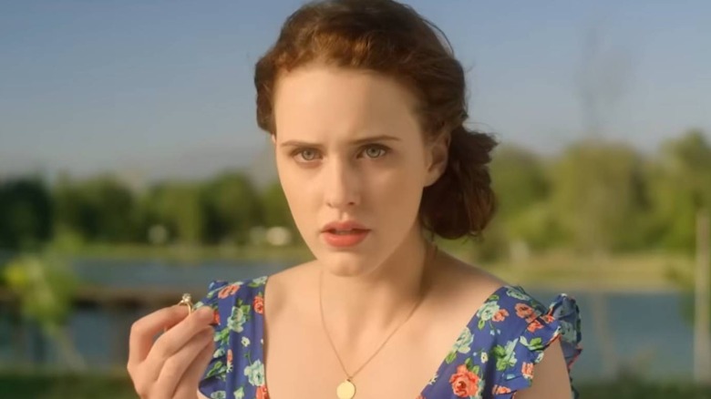 Girl (Rachel Brosnahan) holding a ring in Munchausen