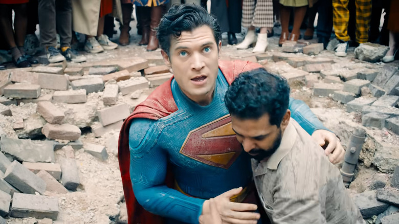 A bystander helping Superman up in Superman