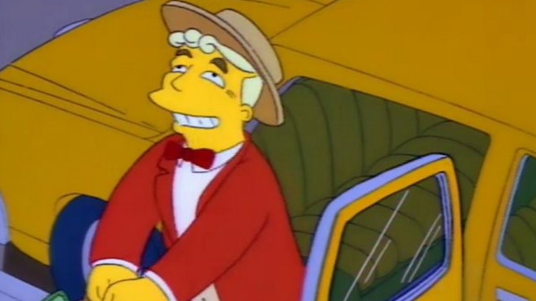 Lale Lenny in the full musical person regalia smiles while getting into a taxi in Simpsons