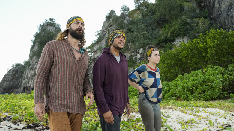 Jonathan Joe and Aubry looking confused on the beach on Survivor 50