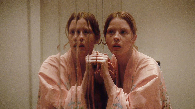 Mia Goth in the mirror in Suspiria