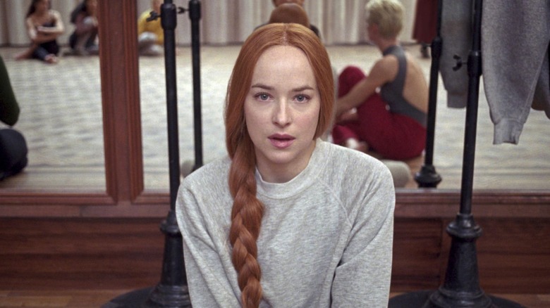Dakota Johnson looks into the camera in Suspiria