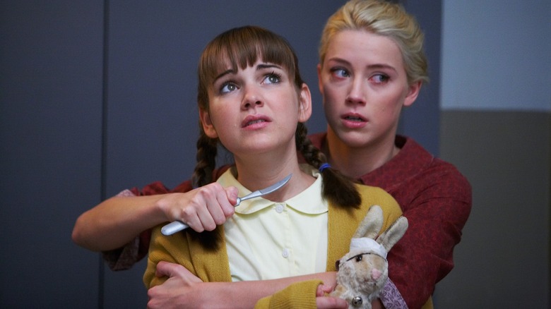 Kristen holding a knife to Laura-Leigh's throat in The Ward