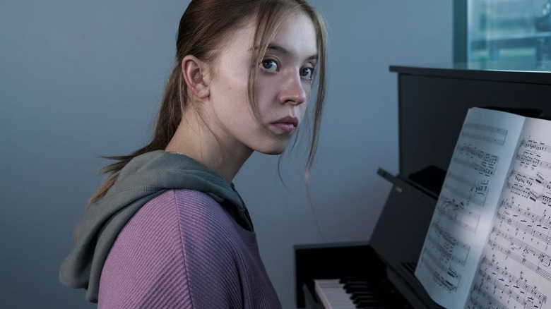 Juliet (Sydney Sweeney) sits at a piano in front of sheet music, her head turned and lips pursed in a tense expression in Nocturne