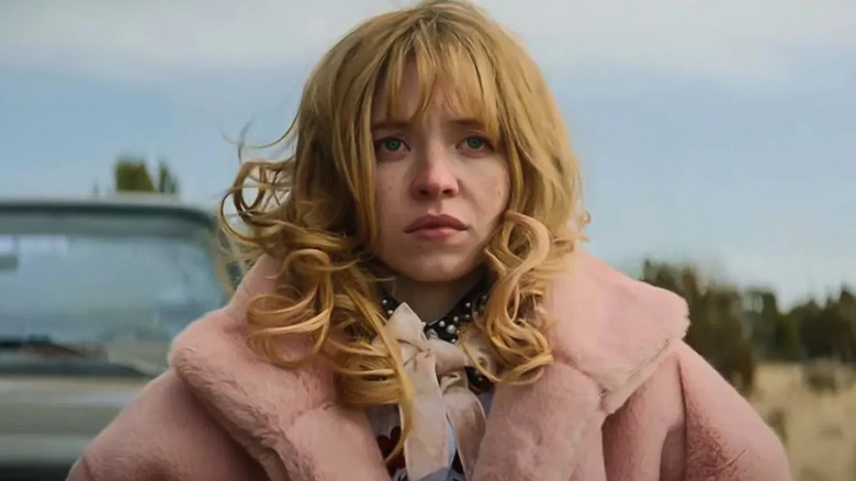 Penny Jo in a pink coat in the movie Americana