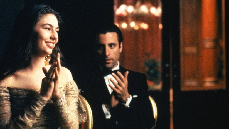 Mary and Vincent applauding, Vincent looks at Mary in The Godfather Part III.