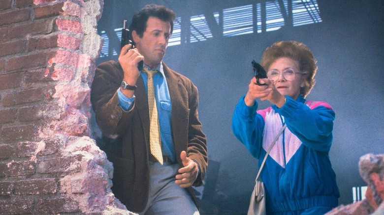 Sylvester Stallone as Joe Bomowski marvels at a gun-toting Estelle Getty as Tutti Bomowski in Stop! Or My Mom Will Shoot
