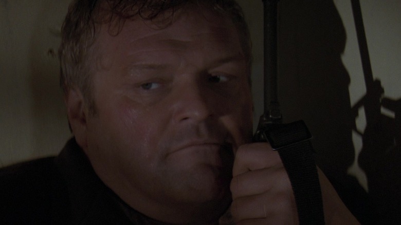 Brian Dennehy's Sheriff William Teasle talks on a two-way radio in First Blood