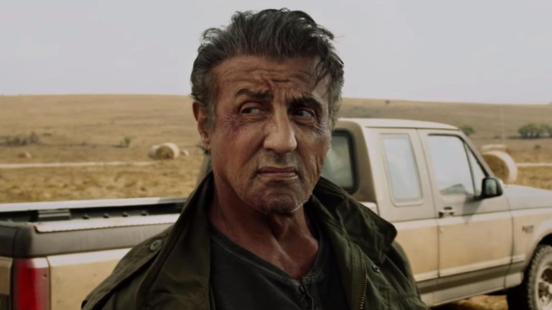John Rambo scowling and looking off camera in Rambo: Last Blood