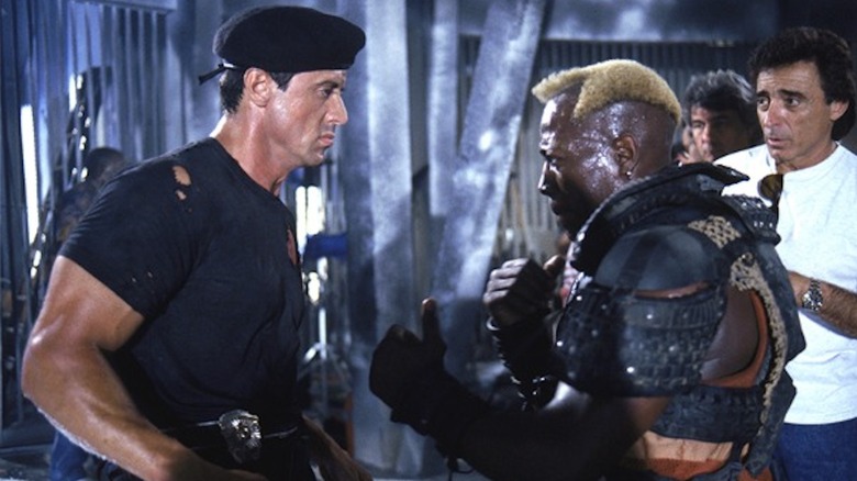 Sylvester Stallone as John Spartan and Wesley Snipes as Simon Phoenix face off in Demolition Man