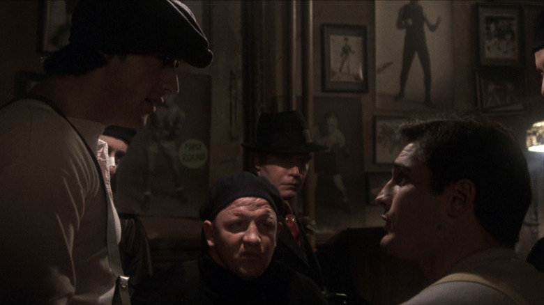 Sylvester Stallone as Cosmo Carboni stands opposite Lee Canalito as Victor Carboni in Paradise Alley