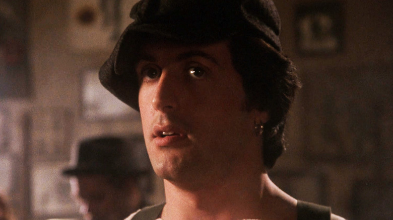 Sylvester Stallone as Cosmo Carboni smiling in Paradise Alley