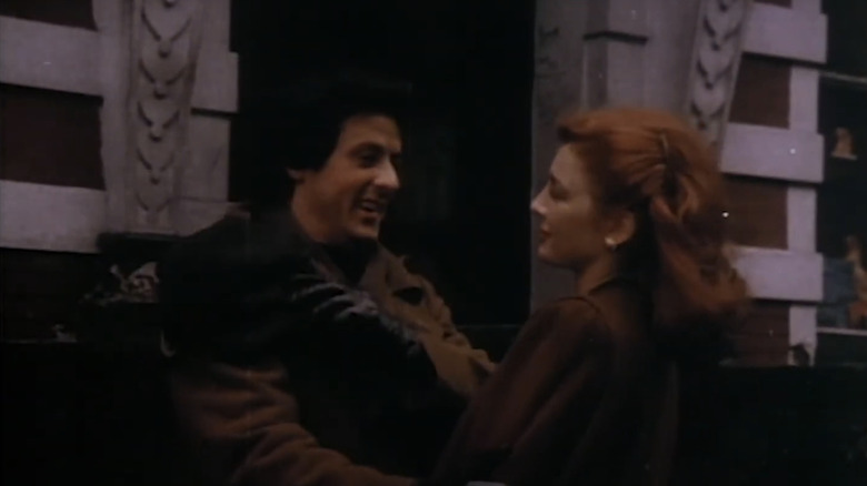 Sylvester Stallone as Cosmo Carboni smiles as he stands opposite Anne Archer as Annie O'Sherlock in Paradise Alley