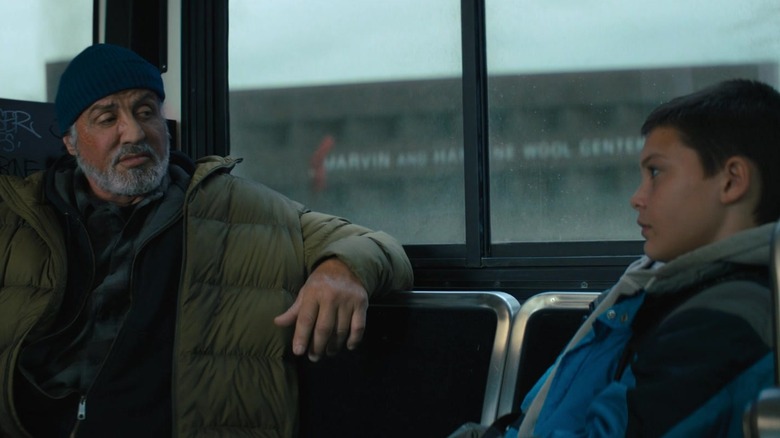 Sylvester Stallone's Joe Smith sits on a bus opposite Javon Walton's Sam Cleary in Samaritan