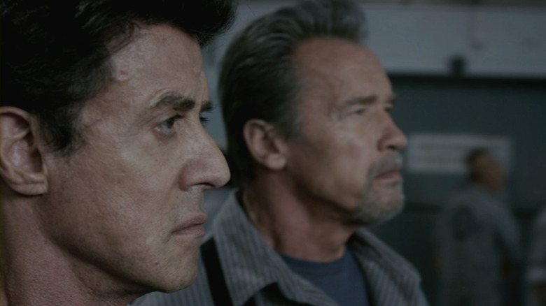 Sylvester Stallone's Ray Breslin stands beside Arnold Schwarzenegger's Emil Rottmayer in Escape Plan