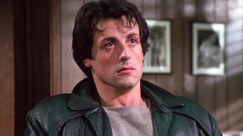 Sylvester Stallone's Rocky Balboa looks up while he sits in an office in Rocky