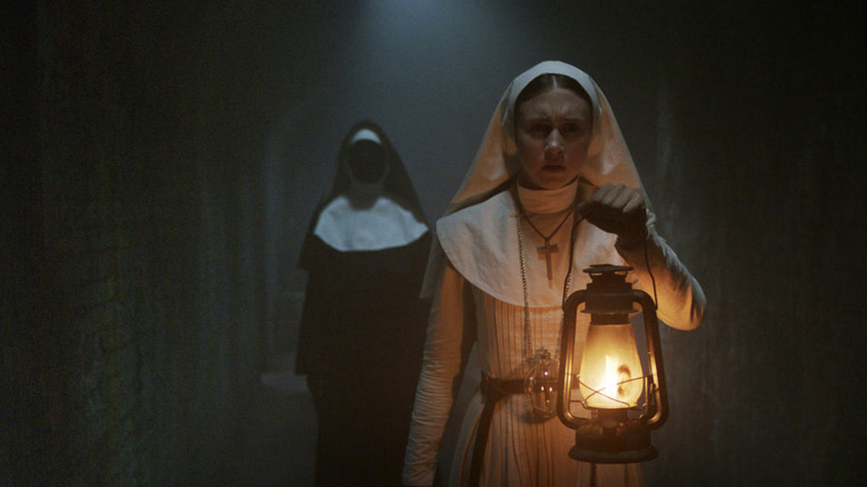 Bonnie Aarons and Taissa Farmiga in The Nun
