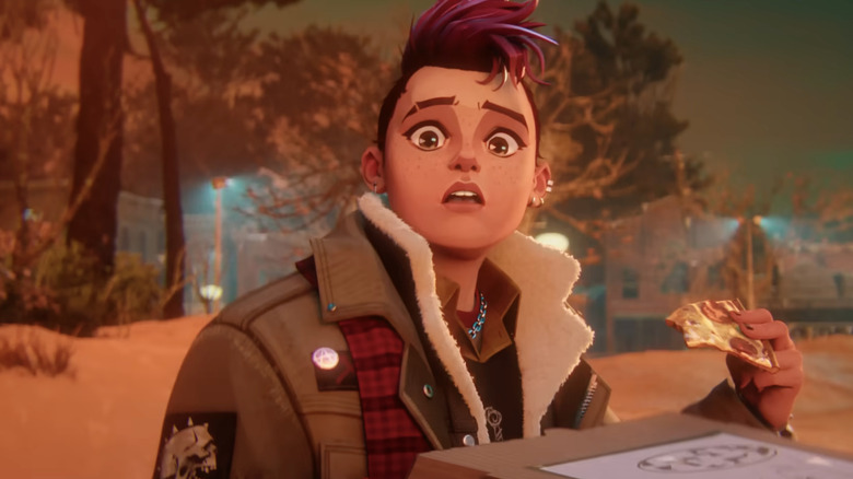 Nikki (Odessa A'zion) holding a pizza slice in "Stranger Things: Tales from '85."