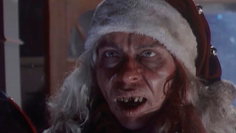 A killer Santa with bad teeth on Tales From the Crypt