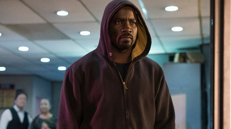 Luke Cage in hood outside building