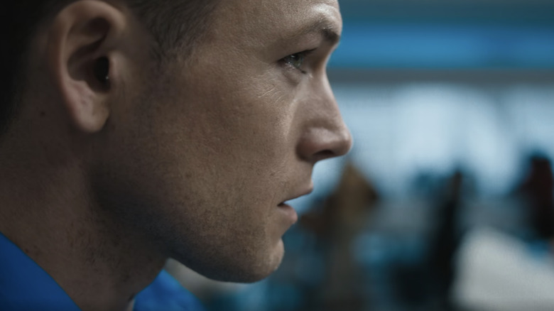 Taron Egerton's Ethan Kopek is seen in closeup from the side in Carry-On