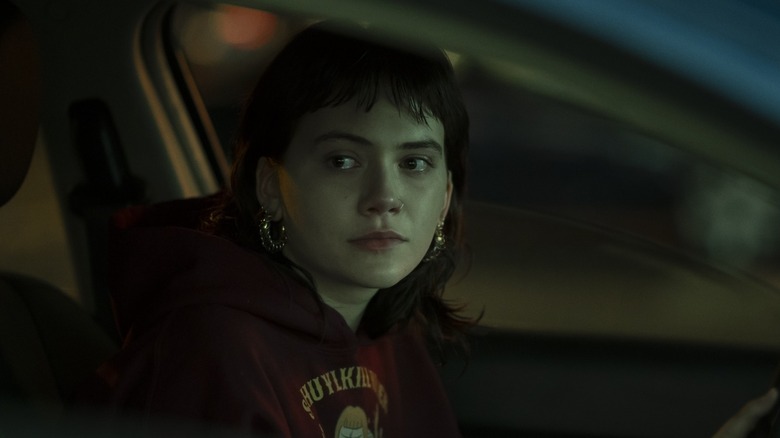 Emilia Jones as Maeve sat in a car in Task Episode 2