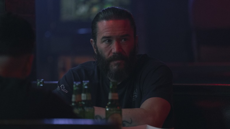 Tom Pelphrey as Robbie sat in a bar in Task Episode 1