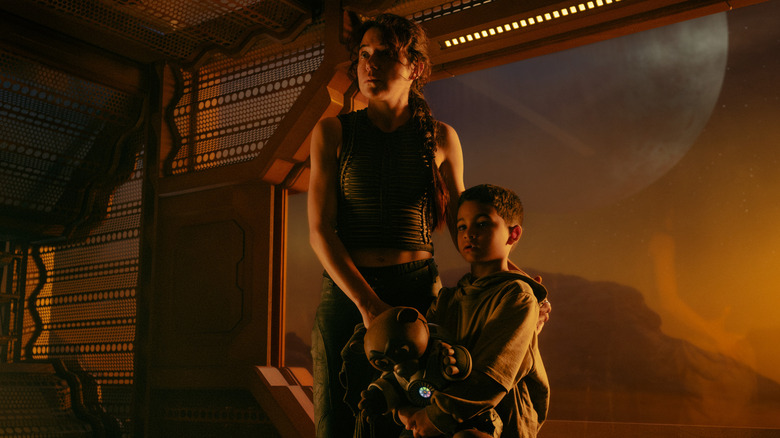 Tatiana Maslany as Anisha standing with Solen Morales as Young Caleb in Star Trek: Starfleet Academy, episode 1, season 1